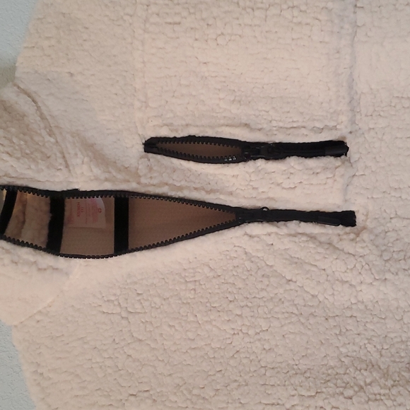 Junior's fleece sweatshirt. Cream with black trim and zippers. Size 1. - Picture 2 of 3